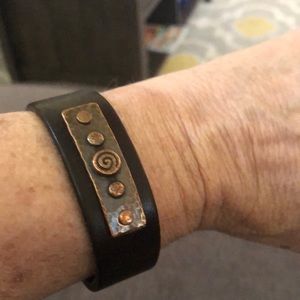 J Bloom leather band bracelet with beautiful detail ornaments.